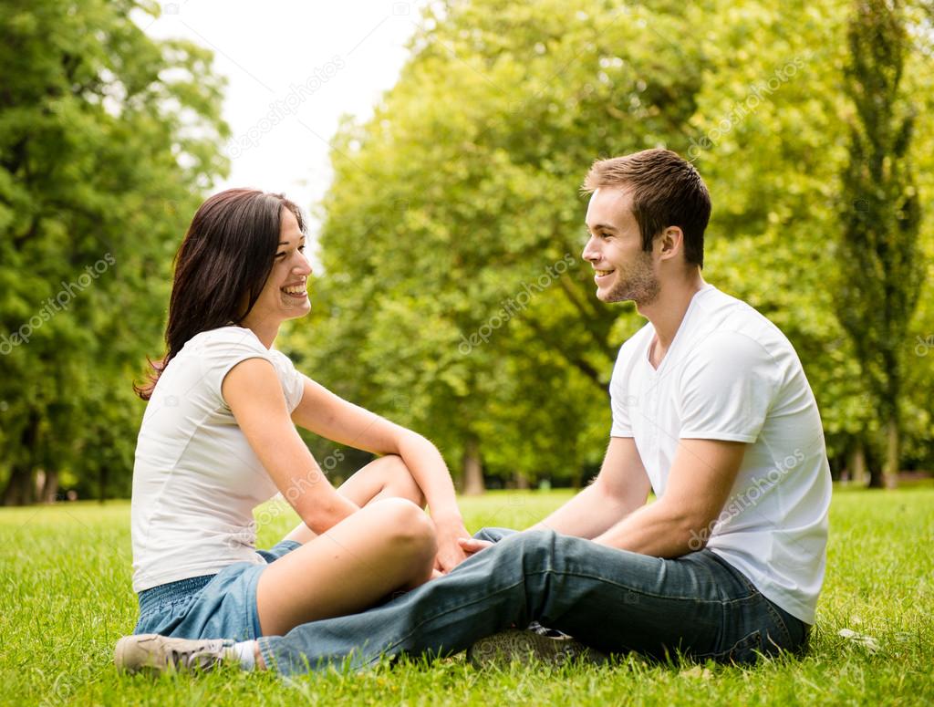 depositphotos 18169923 stock photo young couple talking outdoor