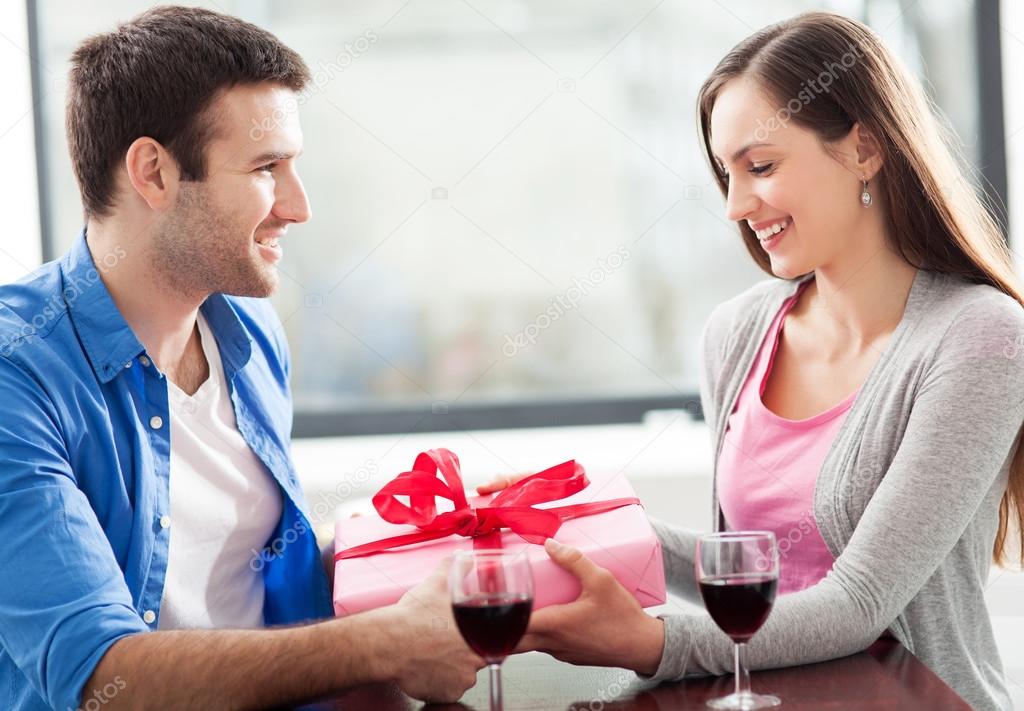 depositphotos 23642815 stock photo man giving woman gift at