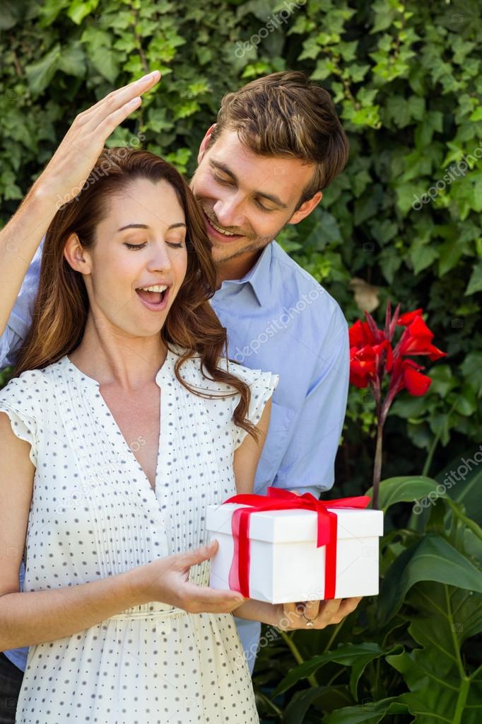 depositphotos 104774224 stock photo man giving gift to woman