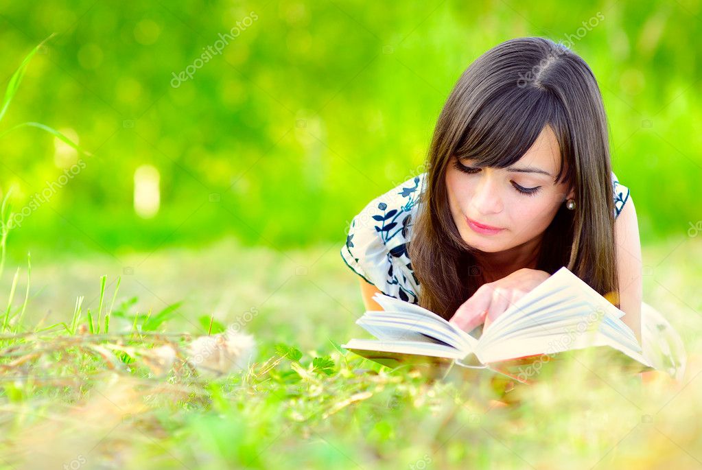 depositphotos 1596873 stock photo girl reads book on meadow